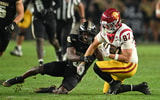 Purdue Boilermakers defensive back Tony Grimes (0) tackles USC Trojans tight end Lake McRee (87) during the second half at Ross-Ade Stadium
