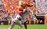 Angelina Alcantar/News Sentinel / USA TODAY NETWORK via Imagn Images | Georgia defensive back Daniel Harris (7) tackles Tennessee wide receiver Braylon Staley (14) as Staley catches the ball before a NCAA football game between Tennessee and Georgia at Neyland Stadium in Knoxville, Tennessee, on September 13, 2025.