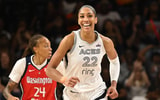Las Vegas Aces center A'ja Wilson (22) is all smiles after a basket against the Washington Mystics during the fourth quarter at CareFirst Arena. Mandatory Credit: Rafael Suanes-Imagn Images