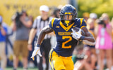 West Virginia running back Tye Edwars carries the ball against Pitt