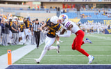 West Virginia wide receiver Rodney Gallagher scores against Kansas in 2024