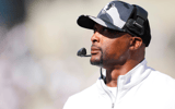 Sep 6, 2025; Cincinnati, Ohio, USA; Bowling Green Falcons head coach Eddie George works to the sideline against the Cincinnati Bearcats in the first half at Nippert Stadium. Mandatory Credit: Aaron Doster-Imagn Images