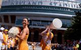Saul Young/News Sentinel / USA TODAY NETWORK via Imagn Images | University of Tennessee cheerleaders warms up the crowd ahead of the Vole Walk for NCAA college football game between Tennessee and Georgie on September 13, 2025, Knoxville, Tennessee.