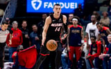 Apr 11, 2025; New Orleans, Louisiana, USA; Miami Heat guard Tyler Herro (14) brings the ball up court against the New Orleans Pelicans during the first half at Smoothie King Center. Mandatory Credit: Stephen Lew-Imagn Images