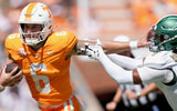 Angelina Alcantar/ News Sentinel / USA TODAY NETWORK via Imagn Images | Tennessee quarterback Joey Aguilar (6) holds off UAB safety Pierre Royster (7) during an NCAA college football game on September 20, 2025, in Knoxville, Tennessee.