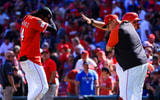 Sep 1, 2025; Cincinnati, Ohio, USA; Cincinnati Reds shortstop Elly De La Cruz (44) reacts with manager Terry Francona (77) after the victory over the Toronto Blue Jays at Great American Ball Park. Mandatory Credit: Katie Stratman-Imagn Images