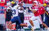 Nebraska football defensive back Donovan Jones chases Michigan RB Jordan Marshall during a 54-yard touchdown run in the Wolverines' 30-27 win over the Huskers