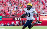 Michigan Wolverines football quarterback Bryce Underwood scored a touchdown in a win over Nebraska. (Photo by Dylan Widger-Imagn Images)