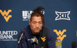 West Virginia wide receiver Rodney Gallagher talks with the media