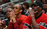 Jul 18, 2025; Indianapolis, IN, USA; Las Vegas Aces forward A’ja Wilson and boyfriend Miami Heat player Bam Adebayo watch the three-point contest during the 2025 WNBA All Star Skills Challenge at Gainbridge Fieldhouse. Mandatory Credit: Trevor Ruszkowski-Imagn Images