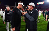 USC Trojans head coach Lincoln Riley meets with Michigan State Spartans head coach Jonathan Smith following the game at the Los Angeles Memorial Coliseum