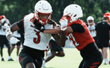 U of L WR Dacari Collins (3) fights to get open on a route on the practice field at Cardinal Stadium in Louisville, Ky. on July 30, 2025.
