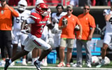 Sep 20, 2025; Louisville, Kentucky, USA; Louisville Cardinals wide receiver Caullin Lacy (5) runs the ball for a touchdown against the Bowling Green Falcons during the first half at L&N Federal Credit Union Stadium. Mandatory Credit: Jamie Rhodes-Imagn Images