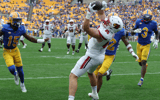 Sep 27, 2025; Pittsburgh, Pennsylvania, USA; Louisville Cardinals tight end Nate Kurisky (85) catches a touchdown pass behind Pittsburgh Panthers defensive backs Rashad Battle (15) and Cruce Brookins (12) during the fourth quarter at Acrisure Stadium. Mandatory Credit: Charles LeClaire-Imagn Images