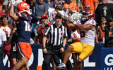USC Trojans wide receiver Makai Lemon (6) scores a touchdown on a pass from quarterback Jayden Maiava (14) as Illinois Fighting Illini defensive back Tanner Heckel (16) defends during the second half at Memorial Stadium