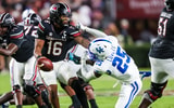 South Carolina QB LaNorris Sellers stiff-arms Kentucky DB Jordan Lovett, via Jeff Blake-Imagn Images
