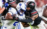 Sep 27, 2025; Columbia, South Carolina, USA; Kentucky Wildcats running back Dante Dowdell (2) is stopped by South Carolina Gamecocks linebacker Dylan Stewart (6) in the second quarter at Williams-Brice Stadium. Mandatory Credit: Jeff Blake-Imagn Images