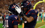 Sep 26, 2025; Charlottesville, Virginia, USA; Virginia Cavaliers wide receiver Trell Harris (11) celebrates with Cavaliers tight end Dakota Twitty (9) after catches a two point conversion as Florida State Seminoles defensive back Jerry Wilson (19) defends in the second overtime period at Scott Stadium. Mandatory Credit: Geoff Burke-Imagn Images
