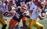 USC Trojans running back Eli Sanders (1) tries to elude the tackle of Illinois Fighting Illini defensive back Tanner Heckel (16) during the second half at Memorial Stadium