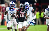 Kentucky defenders try to chase down South Carolina's Vandrevius Jacobs, via Jeff Blake, Imagn Images