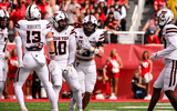 Texas Tech LB Ben Roberts punches out a ball as LB John Curry recovers it