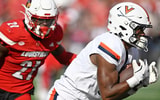 Oct 4, 2025; Louisville, Kentucky, USA; Virginia Cavaliers wide receiver Cam Ross (6) catches a pass against Louisville Cardinals defensive back D'Angelo Hutchinson (21) during the second quarter at L&N Federal Credit Union Stadium. Mandatory Credit: Jamie Rhodes-Imagn Images