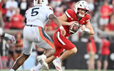 Oct 4, 2025; Louisville, Kentucky, USA; Louisville Cardinals quarterback Miller Moss (7) scrambles under the pressure of Virginia Cavaliers linebacker Kam Robinson (5) during the second half at L&N Federal Credit Union Stadium. Virginia defeated Louisville 30-27. Mandatory Credit: Jamie Rhodes-Imagn Images