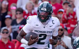Michigan State Spartans quarterback Aidan Chiles (2) rushes for a touchdown during the game against Nebraska at Memorial Stadium. - Kylie Graham, USA TODAY Sports