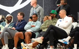 July 19, 2025; North Augusta, South Carolina, USA; NBA star Carmelo Anthony (center right) talks to University of Kentucky basketball coach Mark Pope (right) during the Team Why Not and Team CP3 game at the Nike EYBL Peach Jam at Riverview Park Activity Center. Team Why Not won 66-63. Mandatory Credit: Katie Goodale - Augusta Chronicle/USA TODAY NETWORK