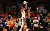 Las Vegas Aces center A'ja Wilson (22) makes a makes the game winning shot against Phoenix Mercury forward Alyssa Thomas (25) in the second half during game three of the 2025 WNBA Finals at PHX Arena. Mandatory Credit: Mark J. Rebilas-Imagn Images