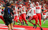 Nebraska football WR Dane Key (6) and the Huskers celebrate after Key makes the game-winning TD catch in the Huskers' 34-31 win over Maryland