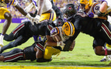 South Carolina Gamecocks defensive lineman Monkell Goodwine (44) forces a fumble at the 1 yard line by LSU Tigers running back Ju'Juan Johnson (8) during the first half at Tiger Stadium. Mandatory Credit: Stephen Lew-Imagn Images