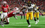 The best shots of the action between the Hawkeyes and Badgers. (Photo by Dennis Scheidt)