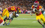 USC lineman Tobias Raymond blocks a Michigan defender as running back King Miller runs for a touchdown