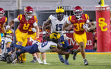 USC running back King Miller carries the ball during a game against the Michigan Wolverines
