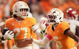 Saul Young/News Sentinel / USA TODAY NETWORK via Imagn Images | Tennessee linebacker Jadon Perlotte (27) is encouraged to run the ball by Tennessee defensive back Jalen McMurray (6) after Perlotte picked up a fumbled ball during the NCAA college football game againstArkansas on Oct. 11, 2025, in Knoxville, Tennessee.