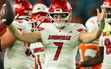 Oct 17, 2025; Miami Gardens, Florida, USA; Louisville Cardinals quarterback Miller Moss (7) celebrates after winning the game against the Miami Hurricanes at Hard Rock Stadium. Mandatory Credit: Sam Navarro-Imagn Images