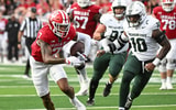 Indiana Hoosiers wide receiver E.J. Williams Jr. (7) runs after a catch past Michigan State Spartans linebacker Wayne Matthews (10) during the first half at Memorial Stadium. - Robert Goddin, USA TODAY Sports
