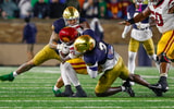 Notre Dame defenders Jaylen Sneed and Jordan Botelho USC