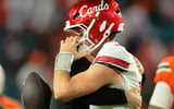 Oct 17, 2025; Miami Gardens, Florida, USA; Louisville Cardinals quarterback Miller Moss (7) celebrates after winning the game against the Miami Hurricanes at Hard Rock Stadium. Mandatory Credit: Sam Navarro-Imagn Images