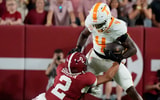 Oct 18, 2025; Tuscaloosa, Alabama, USA; Tennessee Volunteers wide receiver Mike Matthews (4) runs with the ball while being defended by Alabama Crimson Tide defensive back Zabien Brown (2) at Saban Field at Bryant-Denny Stadium. Mandatory Credit: Gary Cosby-USA TODAY Network via Imagn Images