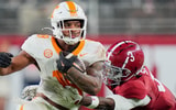 Brianna Paciorka/News Sentinel / USA TODAY NETWORK via Imagn Images | Tennessee running back DeSean Bishop (18) is grabbed by Alabama defensive back Keon Sabb (3) during a college football game at Bryant-Denny Stadium in Tuscaloosa, Ala., on Oct. 18, 2025.