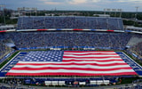 Matt Stone/Courier Journal / USA TODAY NETWORK via Imagn Images | The American flag carried by UK's ROTC covered the football field before the national anthem as the Kentucky Wildcats play Eastern Michigan at Kroger Field in Lexington, Kentucky Saturday, Sept. 13, 2025.