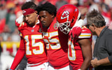 Oct 19, 2025; Kansas City, Missouri, USA; Kansas City Chiefs defensive tackle Omarr Norman-Lott (55) is helped off the field by quarterback Patrick Mahomes (15) and and cornerback Nohl Williams (20) after an injury against the Las Vegas Raiders during the third quarter of the game at GEHA Field at Arrowhead Stadium. Mandatory Credit: Denny Medley-Imagn Images