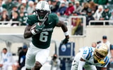 Michigan State wide receiver Nick Marsh (6) runs after catching the ball in the fourth quarter against the UCLA Bruins at Spartan Stadium. - Brendan Mullin, USA TODAY Sports