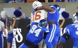 Kentucky’s Kam Olds and Tavion Gadson (94) sacks Texas’ Arch Manning Saturday night at Kroger Field. Oct. 18, 2025 (© Scott Utterback/Courier Journal / USA TODAY NETWORK via Imagn Images)