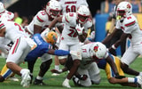 Sep 27, 2025; Pittsburgh, Pennsylvania, USA; Louisville Cardinals running back Duke Watson (26) runs the ball against the Pittsburgh Panthers during the second quarter at Acrisure Stadium. Mandatory Credit: Charles LeClaire-Imagn Images