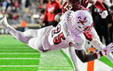Oct 25, 2024; Chestnut Hill, Massachusetts, USA; Louisville Cardinals running back Isaac Brown (25) dives for a touchdown against the Boston College Eagles during the first half at Alumni Stadium. Mandatory Credit: Eric Canha-Imagn Images
