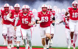 Nebraska football OL Teddy Prochazka (65), OL Rocco Spindler (50), QB Dylan Raiola (15), OL Henry Lutovsky (59) and DL Elijah Jeudy ahead of the Huskers' 28-21 win over Northwestern