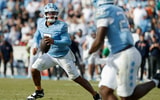 North Carolina quarterback Gio Lopez scrambles out of the pocket against Virginia.